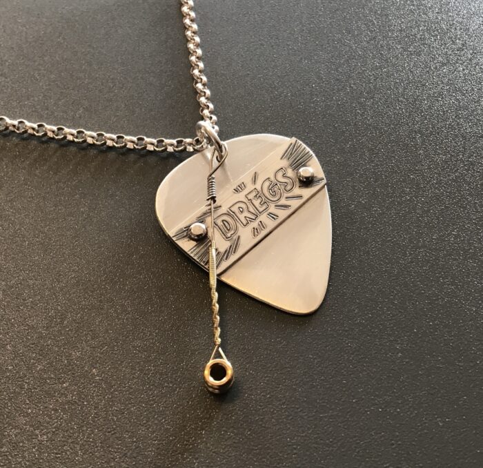 Dregs Banner Silver Pick with played string - Image 2