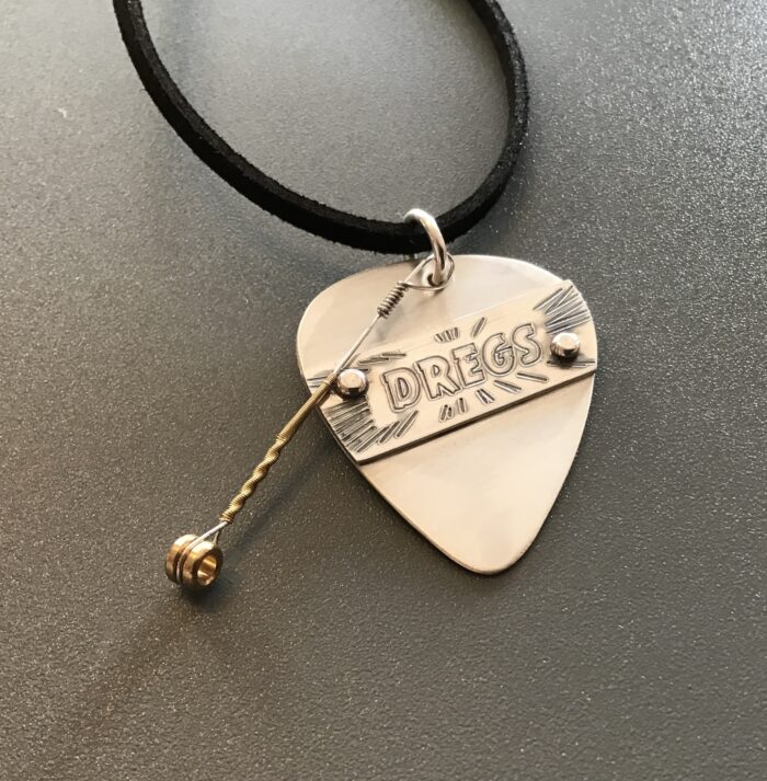 Dregs Banner Silver Pick with played string
