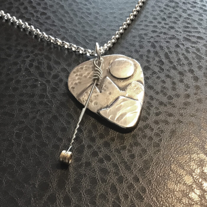 "Great Mountain Spirits" solid silver pendant with played string